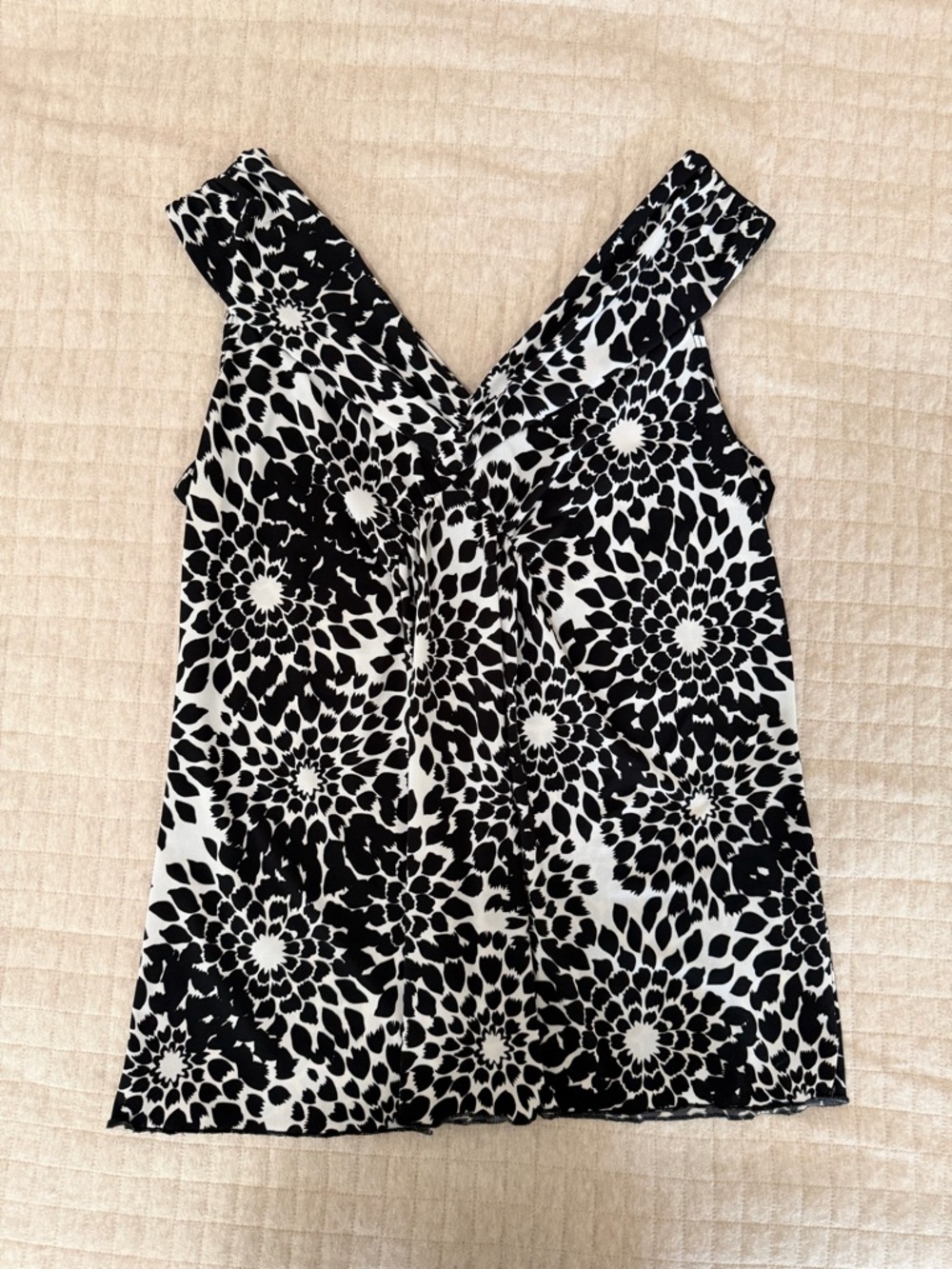 Sleeveless Black and White Floral Twist-Front Blouse